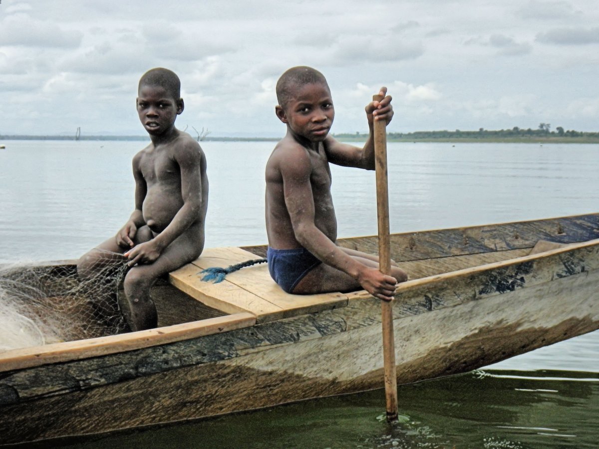 Children photographed fishing on Lake Volta, Ghana, in 2013 Source: IJM
